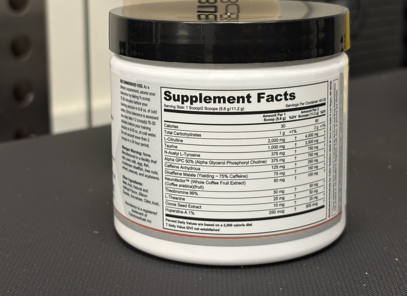 Supplement Facts label on a Prevail pre-workout tub showing caffeine per one scoop and per two scoops: 125 mg caffeine anhydrous and 75 mg dicaffeine malate per scoop